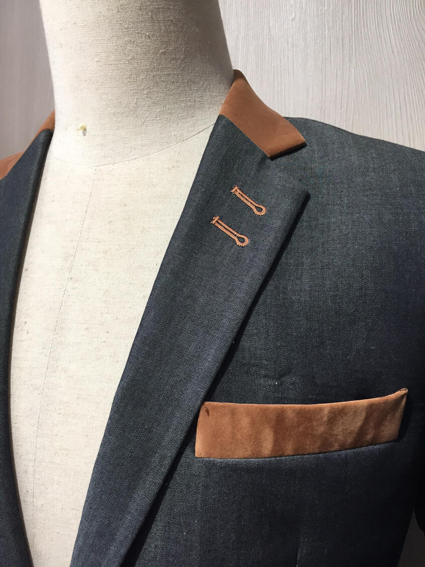 Close-up of custom tailored men’s jacket with contrast lapel by Vy in New York City