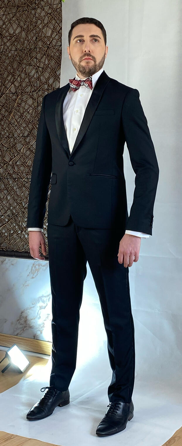 Man wearing a custom tailored black suit with bow tie made by Vy in New York City