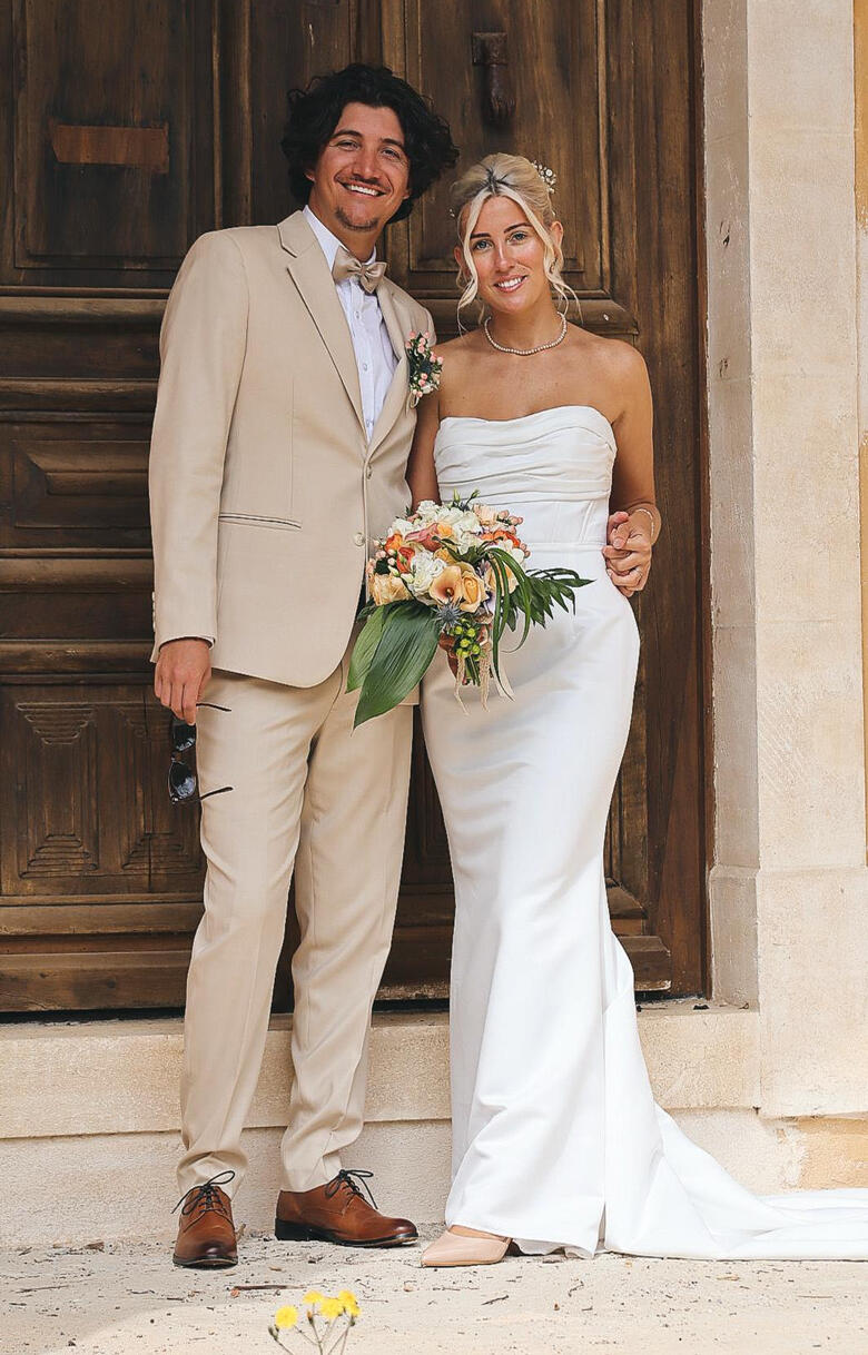Bride wearing a tailored wedding dress and groom wearing a custom suit tailored by Vy in New York City