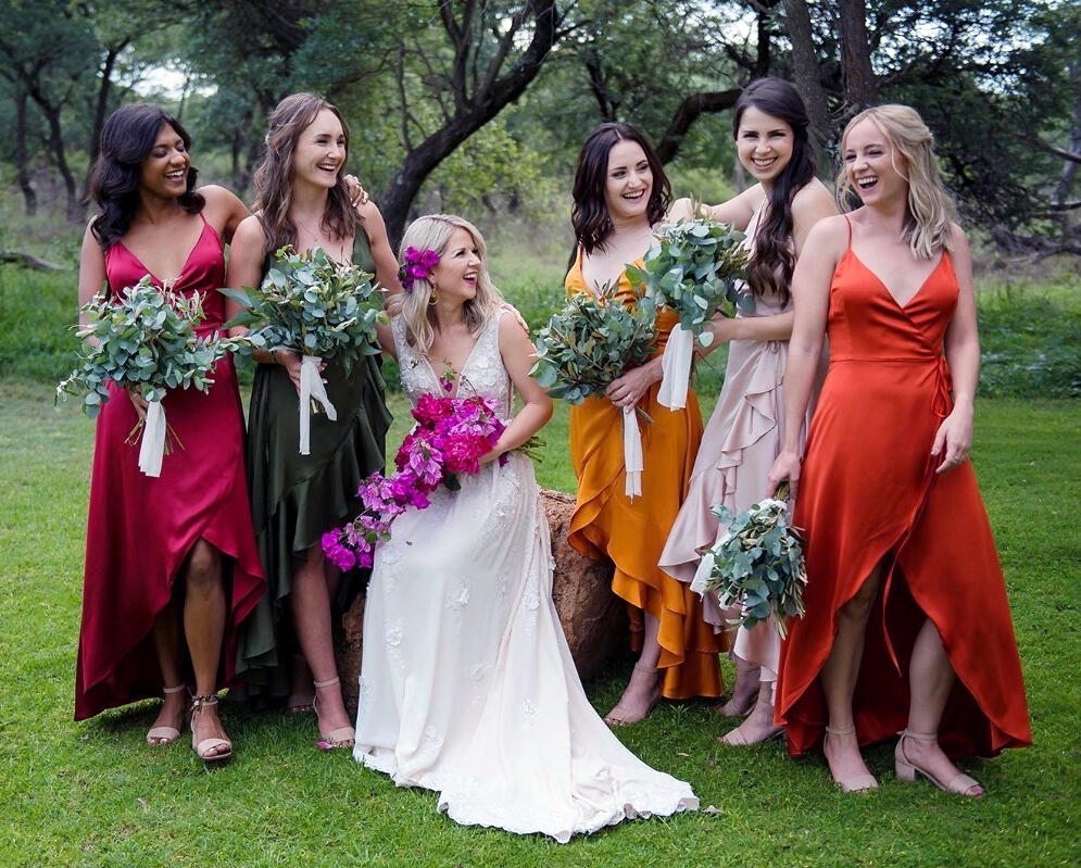 Bride and bridesmaids wearing wedding dresses and bridesmaid dresses tailored or altered by Vy in New York City